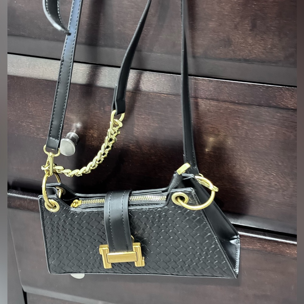 Black woven evening bag with gold hardware